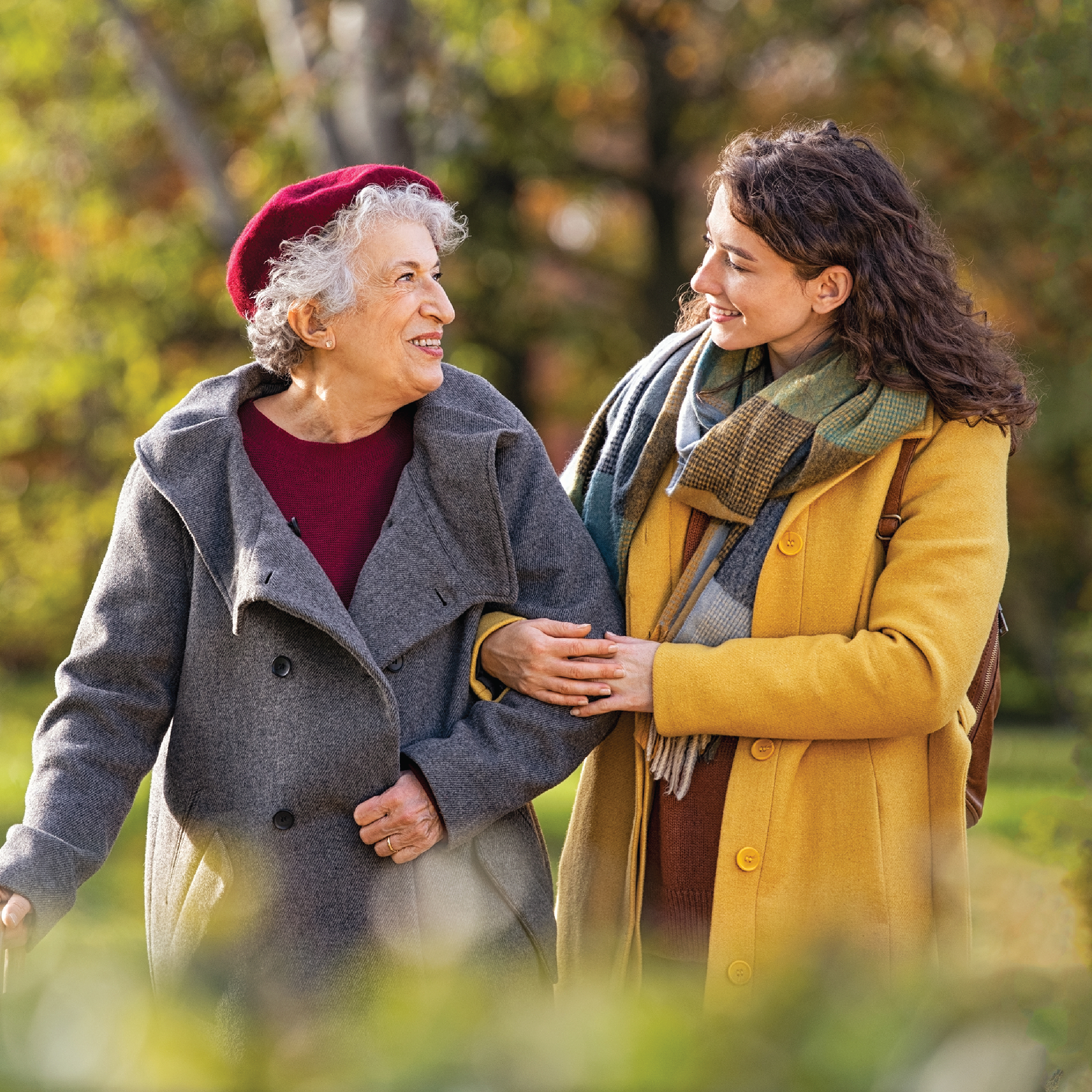 Grandmother and granddaughter walking arm in arm, representing comfort and confidence with Abena USA incontinence care